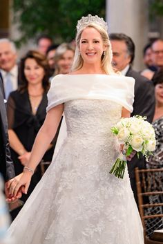 a bride and groom walking down the aisle