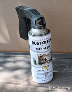 a can of rustoleum sitting on top of a table next to a wall