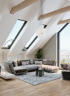 a living room filled with lots of furniture and large windows on top of the roof