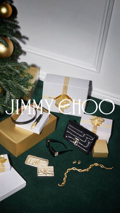 the jimmy choo christmas tree is surrounded by presents