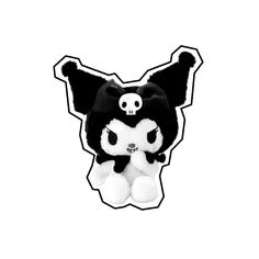 a black and white stuffed animal with a skull on it's head, sitting in front of a white background