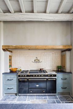 a kitchen with an oven, stove and counter tops in it's center area