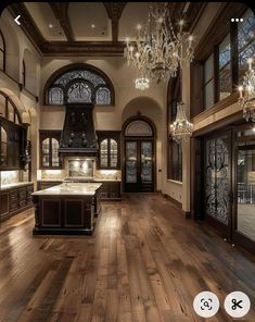 a large kitchen with wooden floors and chandelier