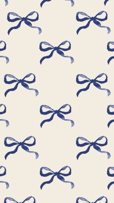 a blue and white bow pattern is shown on a wallpaper background that looks like something out of an old book