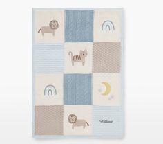 a blue and white rug with animals, sheeps, and moon on the side