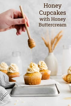 honey cupcakes with honey buttercream being drizzled