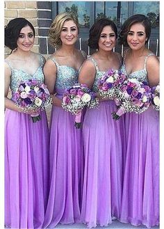 the bridesmaids are all wearing purple dresses