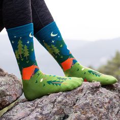 Buy On Amazon Embrace the great outdoors with these funny camping socks to keep your feet warm and spirits high! The design features a beautiful camping scene complete with bonfire, mountains, lake, canoe, starry night sky and bear prints, while the bottom of the socks showcases a funny saying: “I’d Rather Be Camping.” Any outdoorsy man or woman is sure to love these socks! Perfect for those who enjoy hiking, camping, back-packing and exploring. PRODUCT DETAILS: Crew Length One size fits most (U Camp Socks Pattern, Socks Camping, Camping Socks, Outdoorsy Man, Winter Camping Outfits, Beautiful Camping, Socks Photography, Novelty Gifts For Men, Camp Socks