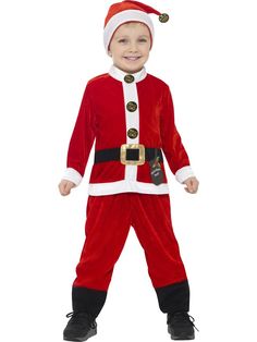 a little boy dressed in a santa costume