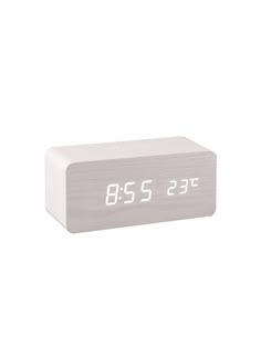 an alarm clock with the time displayed on it's display screen, in front of a white background