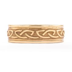 a gold ring with an intricate design on it