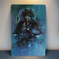 a darth vader painting is shown on a glass plate with a white wall in the background