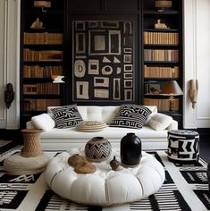 a living room with black and white decor