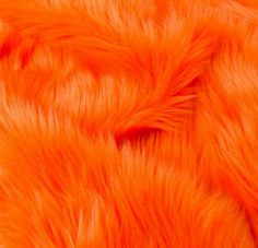 an orange fur texture is shown in close up