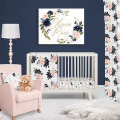 a baby's room with a pink chair, crib and floral wallpaper