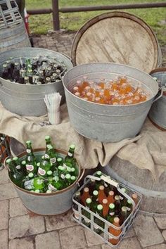 several buckets filled with different types of food