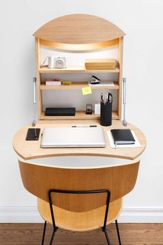 a wooden desk with a laptop on it