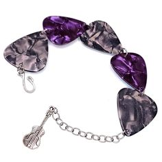 purple guitar picks are attached to a silver chain