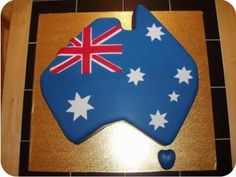 an australian flag shaped cookie on top of a cutting board