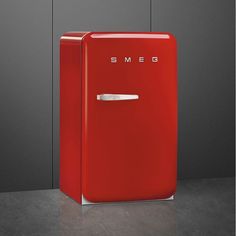 a red refrigerator with the word smed on it's front and side doors