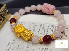 Gift yourself or your loveonce this beautiful Pure Gold Pixiu Bracelet.  *Materials: Au999 Pure Gold, Jade, Dragon Vein Agate,  Chinese Knot, and  Rose Quartz. *Karat: 24K Pure Gold  *Gold Color: Yellow *Gold Weight: Approximately 3.80g SIZE Pixiu Length:  32.2mm/1.26 Inches Stone: Approxiately 10mm 🔸️Pink jade represents love and harmony. It promotes growth, foster understanding, and deepen relationships. 🔸️Pi Xiu has the meaning of bringing in wealth and treasure. Of course, it is capable of Bracelet Materials, Pink Jade, Jade Dragon, Chinese Jewelry, Dragon Vein Agate