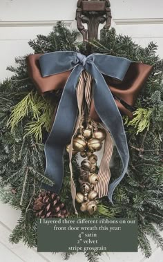 a christmas wreath hanging on the side of a door with a poem written below it