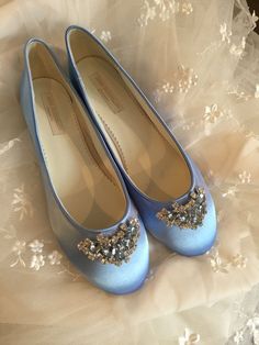 a pair of blue ballet shoes on a wedding dress