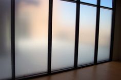 a window with frosted glass in an empty room