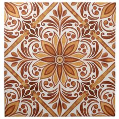 an orange and white tile design with swirls in the center, on a white background