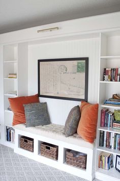 a white bookcase filled with lots of books