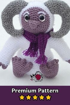 an elephant stuffed animal with purple and white scarf on it's head is shown