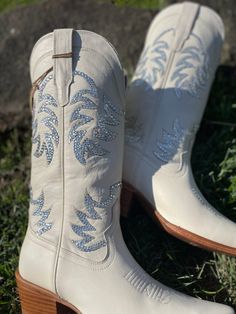 Cowboy boots have been a staple in women’s fashion for decades, transcending trends and creating a timeless sense of style. From classic styles that harken back to the Wild West to modern designs that push the boundaries of traditional footwear, there is a cowboy boot out there for every woman. If you’re new to the … Fitted White Boots For Country Events, Western Boots With Rhinestones And Snip Toe, Western Snip Toe Boots With Rhinestones, Western Style Snip Toe Boots With Rhinestones, White Embellished Snip Toe Boots, Western White Embellished Boots, Silver Fitted Boots For Wedding, Western Boots With Bling And Round Toe, Fitted Snip Toe Wedding Boots