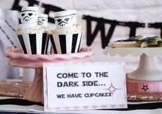 star wars party food and decorations with darth vader cupcakes on top