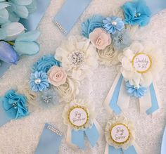 several blue and white flowers are arranged in a circle on a table with baby's breath tags