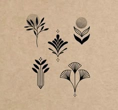 four different types of flowers on a piece of paper with black and white ink in the middle