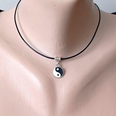 Yin Yang pendant necklace unisex, black white small pendant on leather cord, minimalist jewelry, perfects for gift, gift for him, gift for her necklace pendant small Yin Yang. leather, details silver-colored alloy.  choose your size: Necklace length +/- 15", 16", 17", 18" - 38, 40.5, 43, 45.5 cm). All necklaces have a 1.2" (3 cm) extension chain Recommendations for care: Do not wet, do not drop, avoid contact with perfumes, detergents. Wear with pleasure! Yin Yang Minimalist, Small Pendant, Copper Earrings, Yin Yang, Minimalist Jewelry, Leather Cord, Silver Fashion, Hippie Boho, Gifts For Him