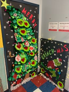 the grinch christmas tree is made out of green paper and has buttons on it