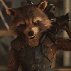 a rocket raccoon in a leather outfit with horns and claws on his head