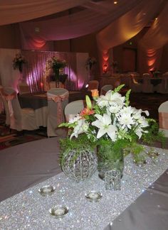 silver & peach bling wedding reception at a convention center