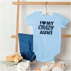 Type:Tee \nBelt:No \nNeckline:Round Neck \nSleeve Type:Regular Sleeve \nFeatures:Stretch \nFeatures:Soft \nFeatures:Great quality \nColor:Light Blue \nPattern Type:Slogan \nPattern Type:Heart \nPattern Type:Geometric \nPattern Type:Letter \nSleeve Length:Short Sleeve \nFabric:Medium Stretch \nFit Type:Regular Fit \nMaterial:Fabric \nComposition:100% Cotton \nCare Instructions:Machine wash or professional dry clean \nPockets:No \nSheer:No \nGender:Unisex \n Aunt Baby, Aunt Quotes, Baby Aunt, Crazy Aunt, Funny Family, Cute Funny Babies, Family Humor, One Piece Bodysuit, Niece And Nephew