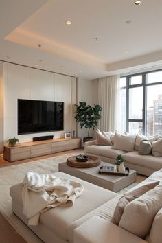 a living room filled with furniture and a flat screen tv