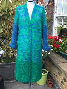 All year women's knit long sleeves sweater. Very light weight, warm and cosy hand knitted mohair cardigan, made from green and sky blue mohair mixtures: 78% mohair, 13% wool, 9% nylon. Made in England.  The length approx. 112cm, 44 inches. One size will fit size S-XL. Gift idea for wife, mum or mother in law. Warm hand wash, cold rinse well, dry flat in shade. Winter Green Knitted Cardigan, Green Knitted Winter Cardigan, Hand Knitted Long Sleeve Green Knitting Pattern, Green Knit Long Sleeve Cardigan, Green Long Sleeve Knitted Cardigan, Green Knitted Acrylic Cardigan, One Size Green Knit Sweater, Green Long Sleeve Hand Knitted Pattern, Green Knitted Cozy Cardigan