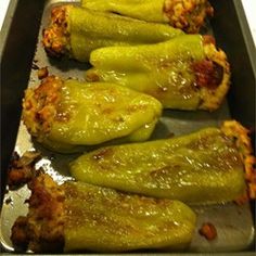 several green peppers on a baking sheet ready to go into the oven for roasting