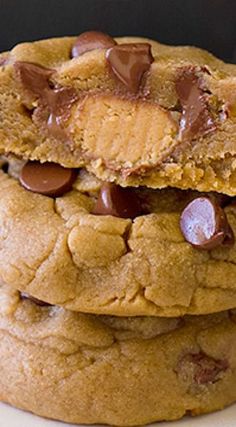 three chocolate chip cookies stacked on top of each other