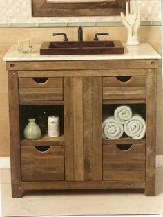 a bathroom vanity with two drawers and a sink under a mirror in the middle of it