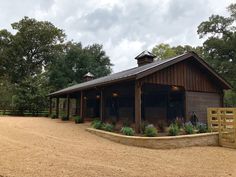 a horse barn with an open front door