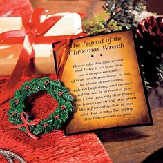 the legend of the christmas wreath is displayed next to a card with a poem on it