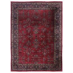 an antique persian rug with red and blue colors on the bottom, surrounded by ornate border