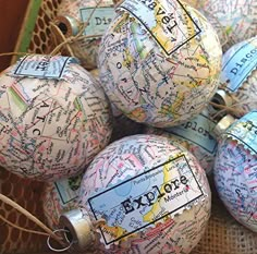 several globe ornaments are sitting in a wicker basket on top of burlocks