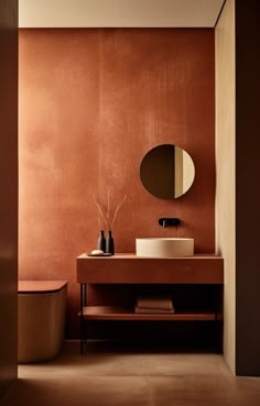 a bathroom with a sink, mirror and toilet in the corner next to a wall